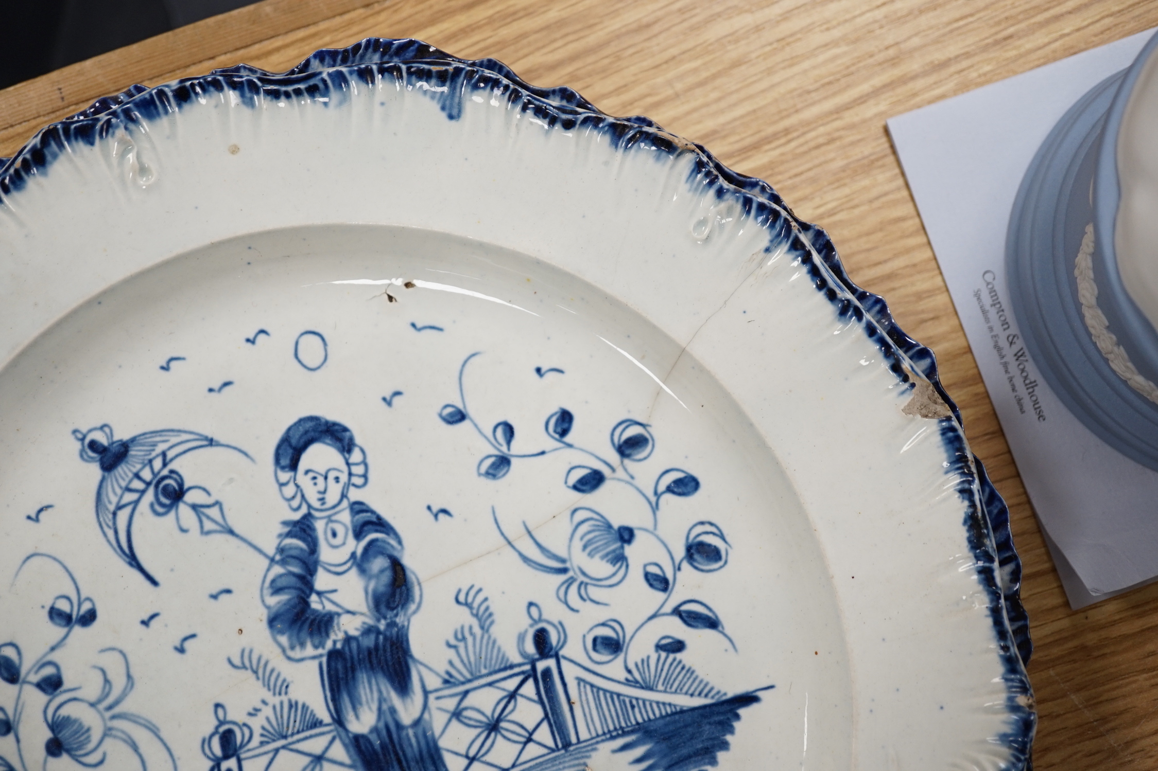 A collection of late 18th/early 19th century pearlware and creamware including three black transfer printed creamware plates, c.1780, blue and white bowls, plates, dishes and jug, the largest 27cm in diameter